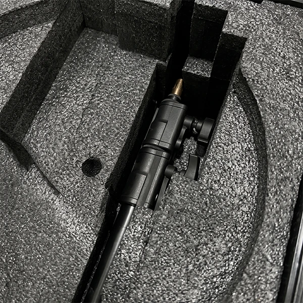 Photo of the collapsed stand placed into its slot in the case foam